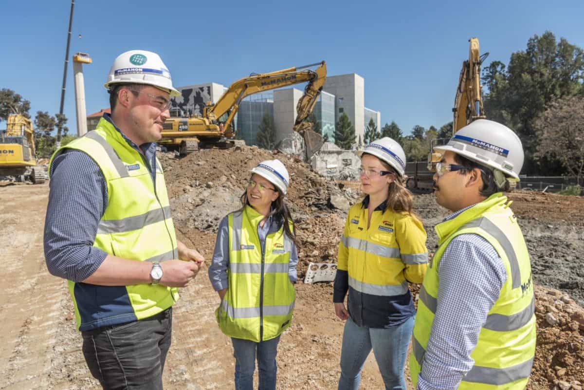 McMahon staff discussing work on site