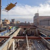 View into roof of building with McMahon Services workers at Lot Fourteen Demolition Site of the Old Royal Adelaide Hospital