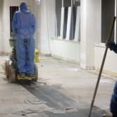 Workers removing and treating asbestos containing materials